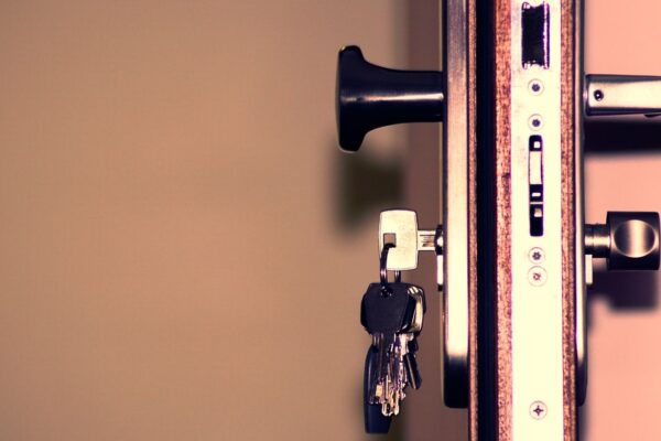 Professional locksmith at work representing locksmith costs in Houston TX