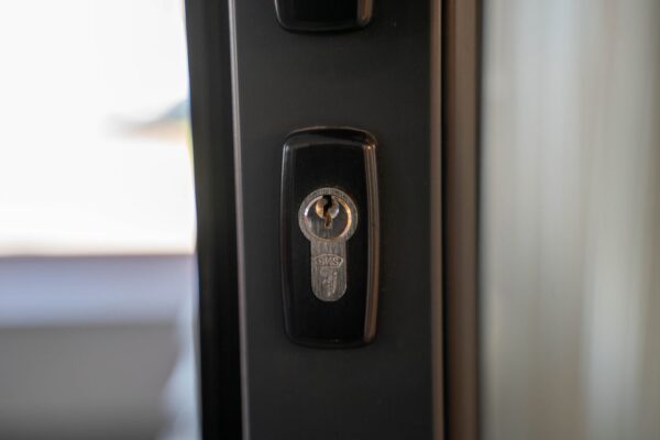 Residential door lock representing rekeying before moving into a Pearland TX home
