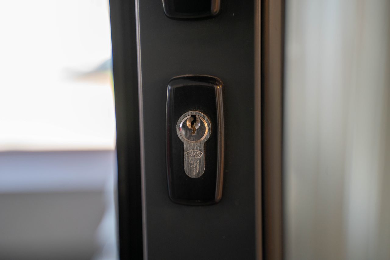 Residential door lock representing rekeying before moving into a Pearland TX home