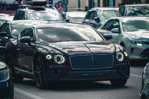 Luxury cars in traffic representing Volvo smart key replacement near Houston TX
