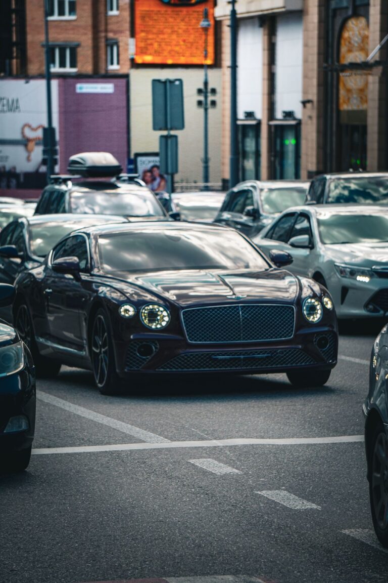 Luxury cars in traffic representing Volvo smart key replacement near Houston TX